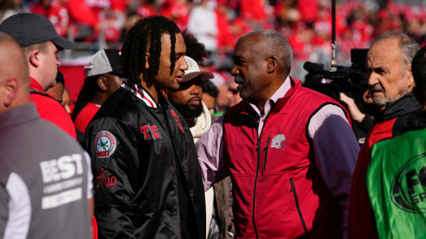 Oct 21, 2023; Columbus, Ohio, USA; Former Ohio State Buckeyes quarterback CJ Stroud, now with the Houston Texans in the NFL, talks to Gene Smith on the sideline prior to the NCAA football game at Ohio Stadium.
